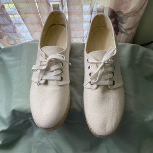 Off-white wedge shoe worn 1X size 9.